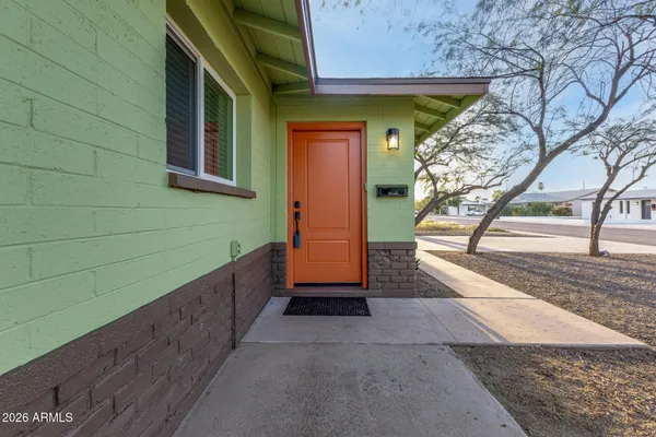 a house with trees in front of it