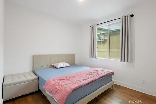 a bedroom with a bed and window