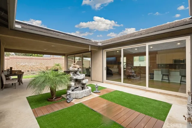 a view of a porch with furniture and floor