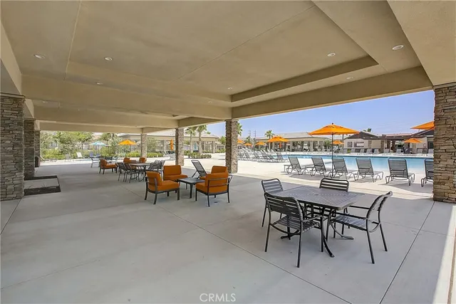 a outdoor space with patio couches and a potted plant