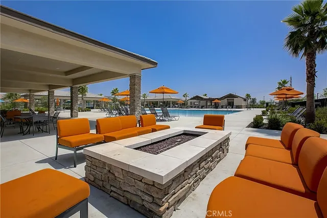 a view of a patio with a table and chairs