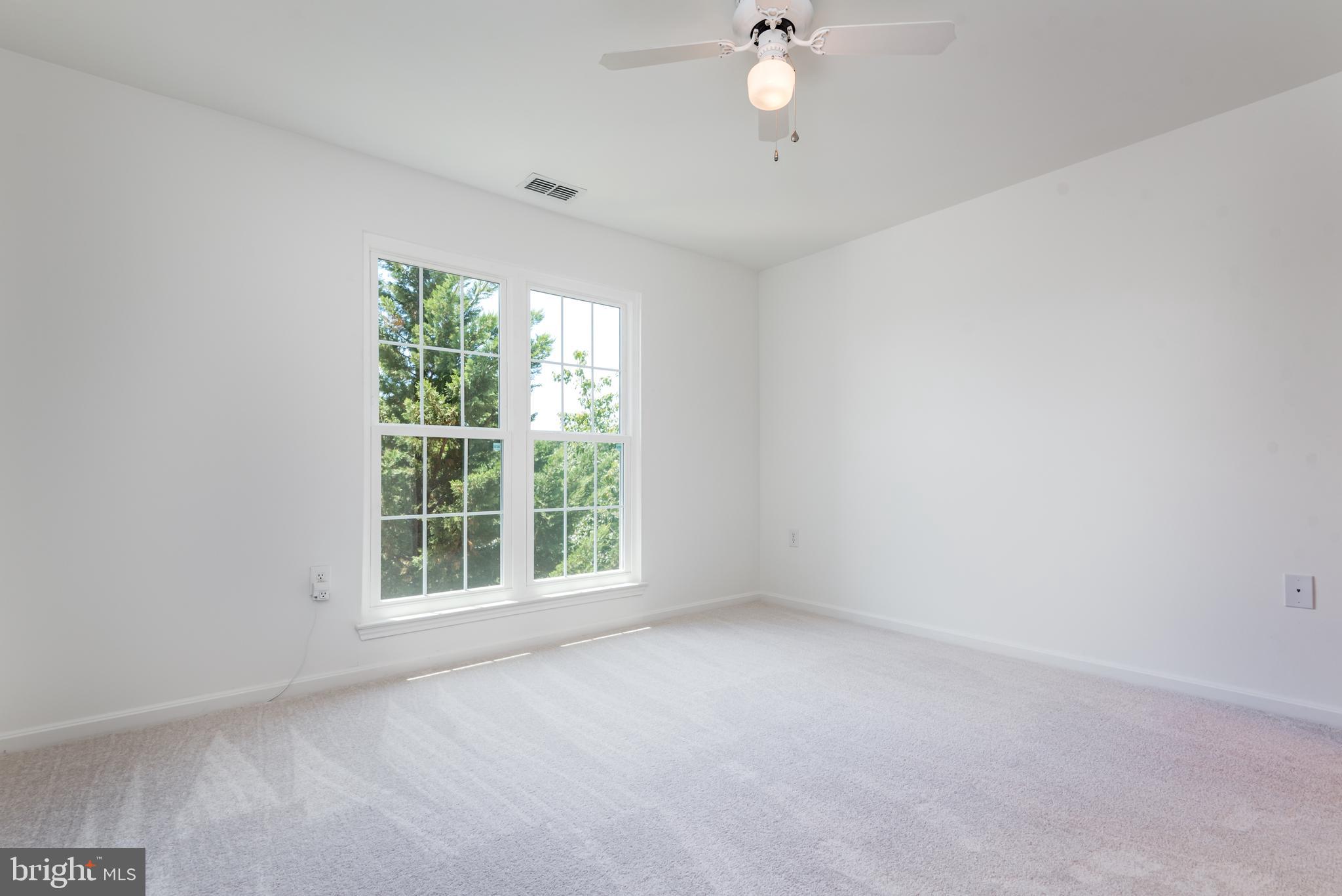 21007 Timber Ridge Terrace, Unit 301 Ashburn, VA 20147 - Photo 16 of 30 Large, bright primary bedroom