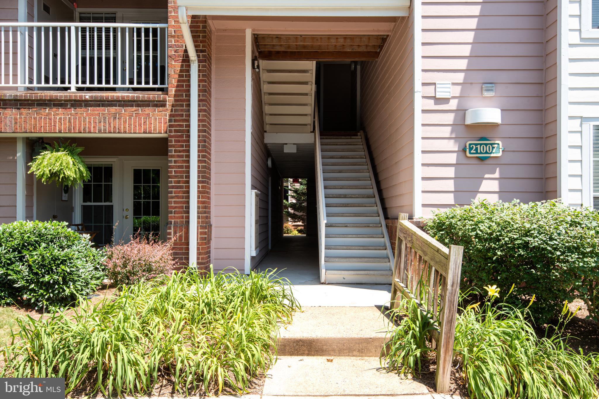 21007 Timber Ridge Terrace, Unit 301 Ashburn, VA 20147 - Photo 3 of 30 Covered mailbox area and stairs to unit