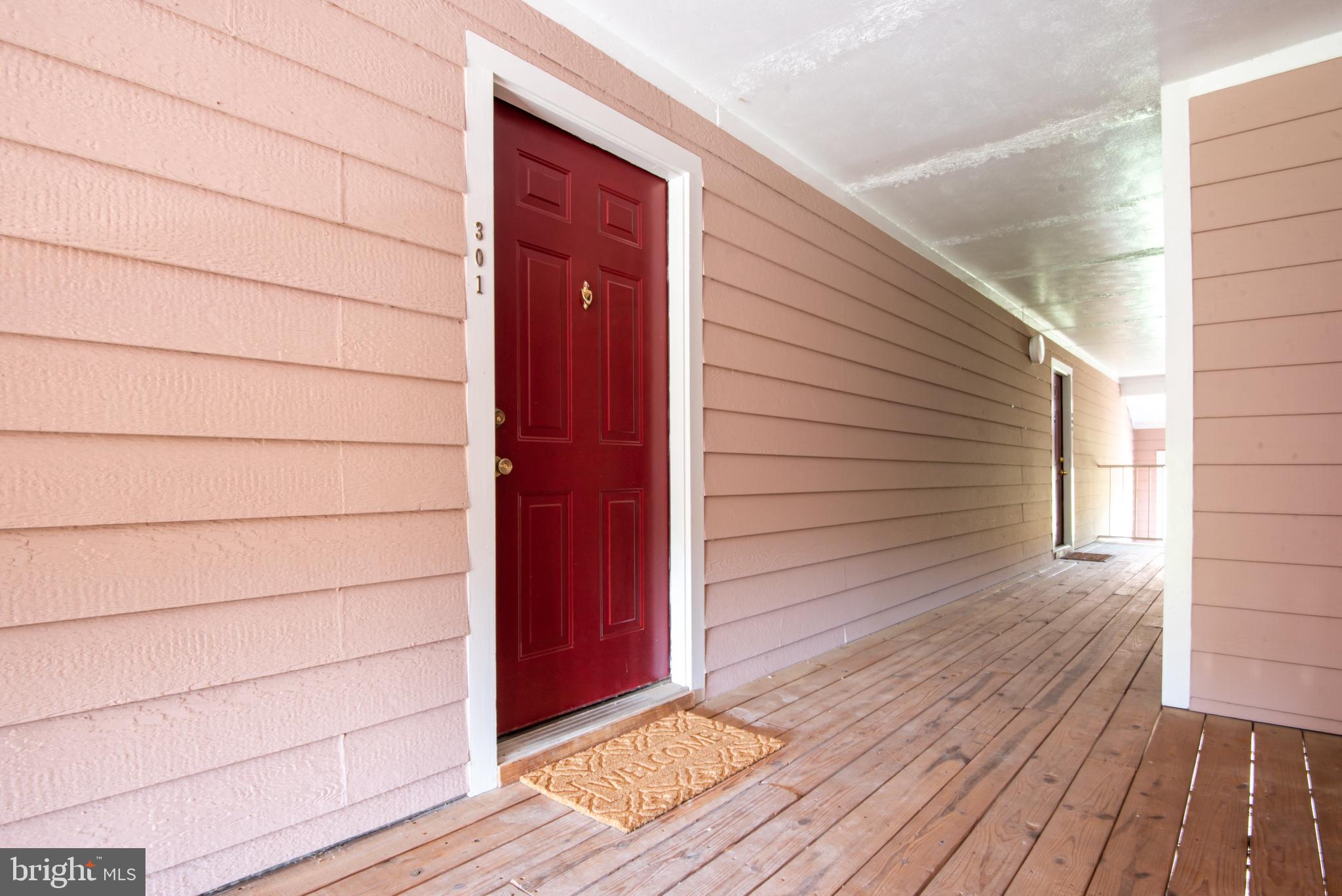 21007 Timber Ridge Terrace, Unit 301 Ashburn, VA 20147 - Photo 6 of 30 Entrance to Unit 301 at top of stairs