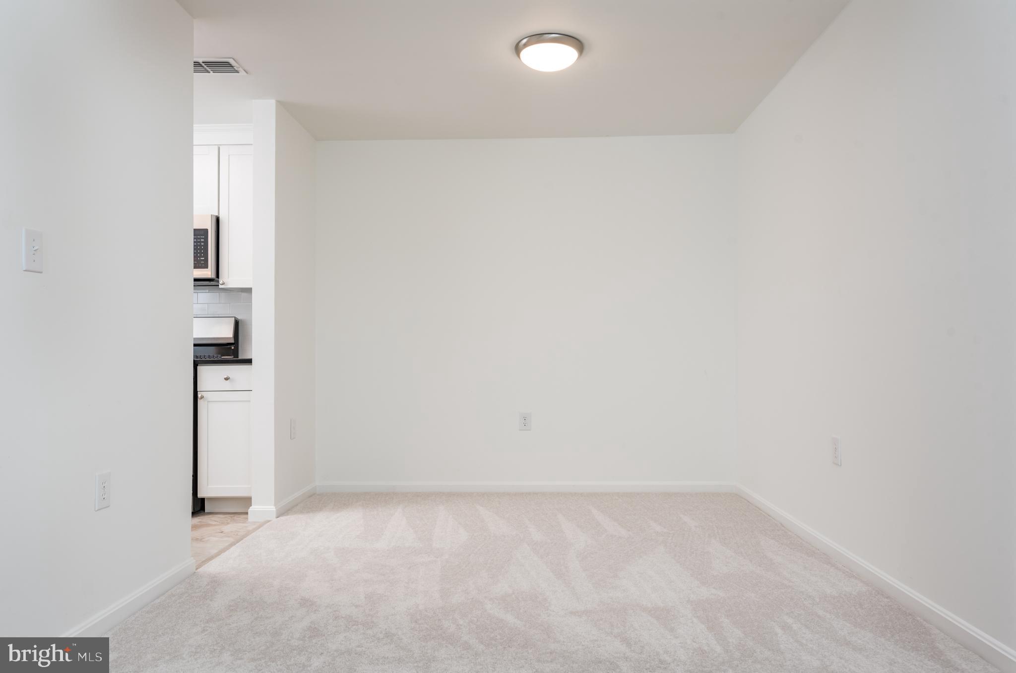 21007 Timber Ridge Terrace, Unit 301 Ashburn, VA 20147 - Photo 10 of 30 Dining room area off kitchen