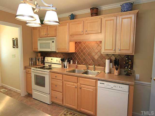 225 Glen Eden Road Durham, NC 27713 - Photo 6 of 18 The kitchen is the heart of the home and your heart will skip a beat when you see this kitchen! Gorgeous tiled backsplash, updated cabinetry and appliances, under cabinet lighting, and new flooring.