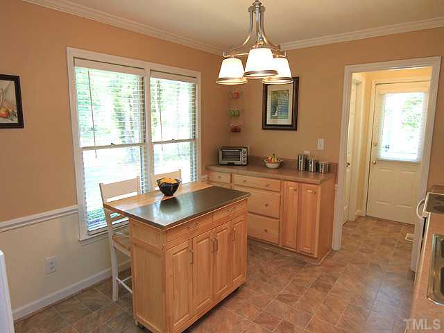 225 Glen Eden Road Durham, NC 27713 - Photo 8 of 18 View from kitchen looking toward utility room and side entrance door Note the great use of space with additional storage possibilities. A cook's delight!