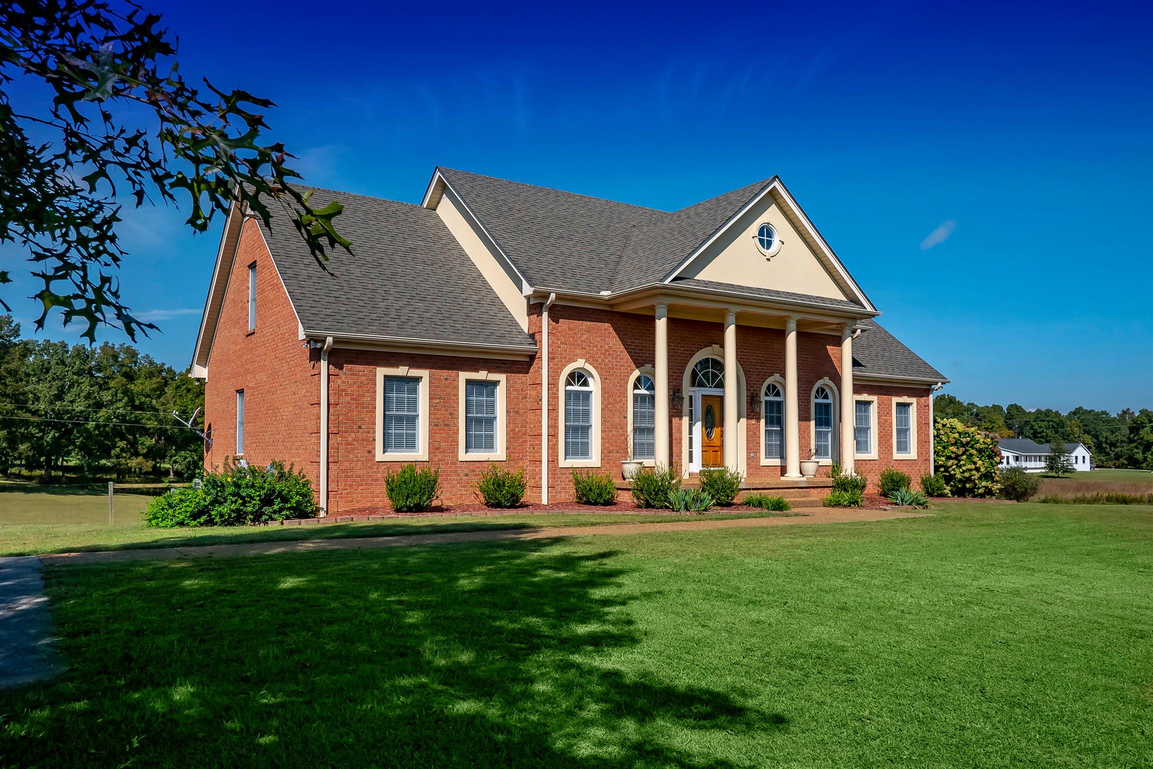 7722 Barnhill Road Primm Springs, TN 38476 - Photo 2 of 30 a front view of a house with a yard