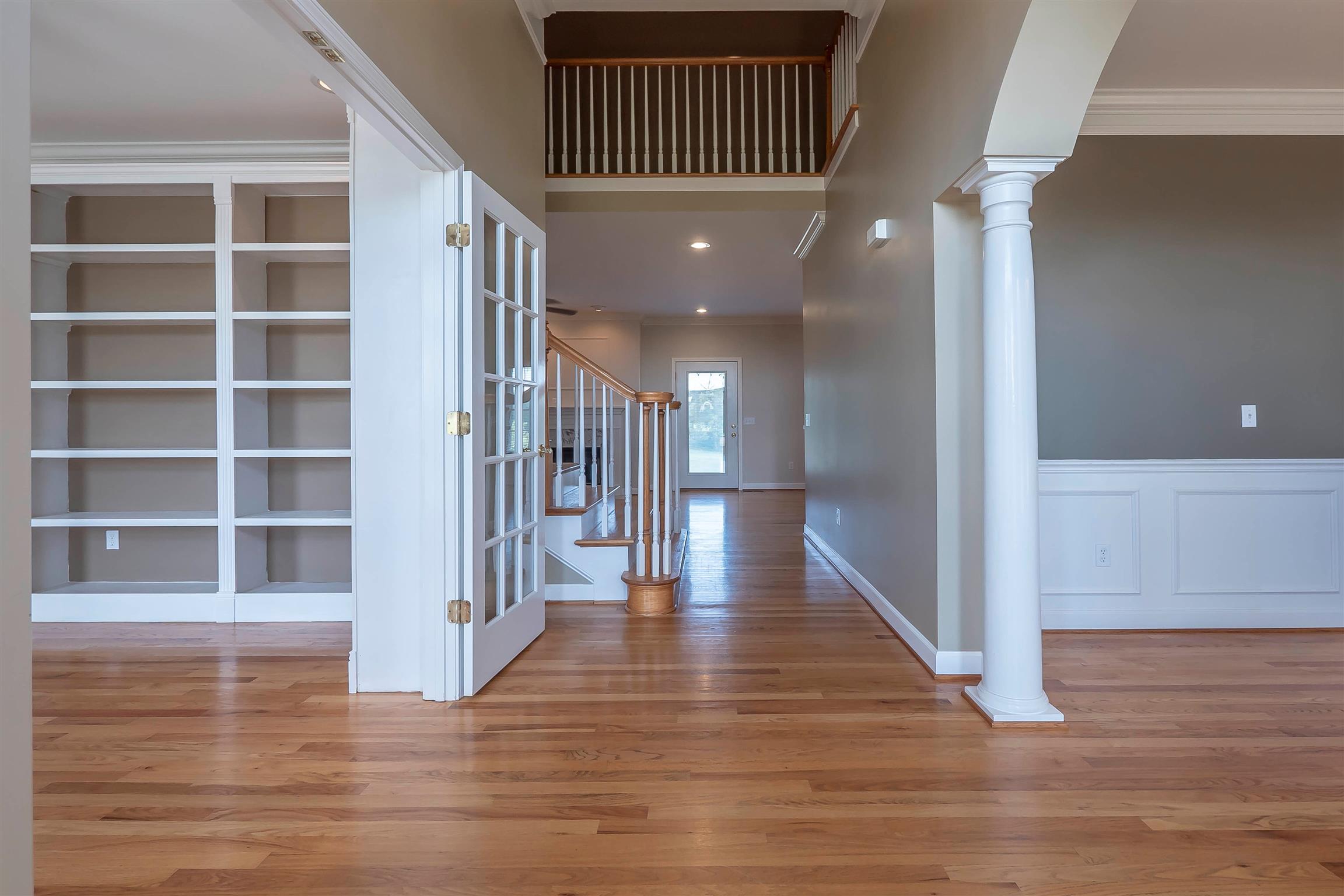 7722 Barnhill Road Primm Springs, TN 38476 - Photo 11 of 30 a view of a hallway with wooden floor and staircase