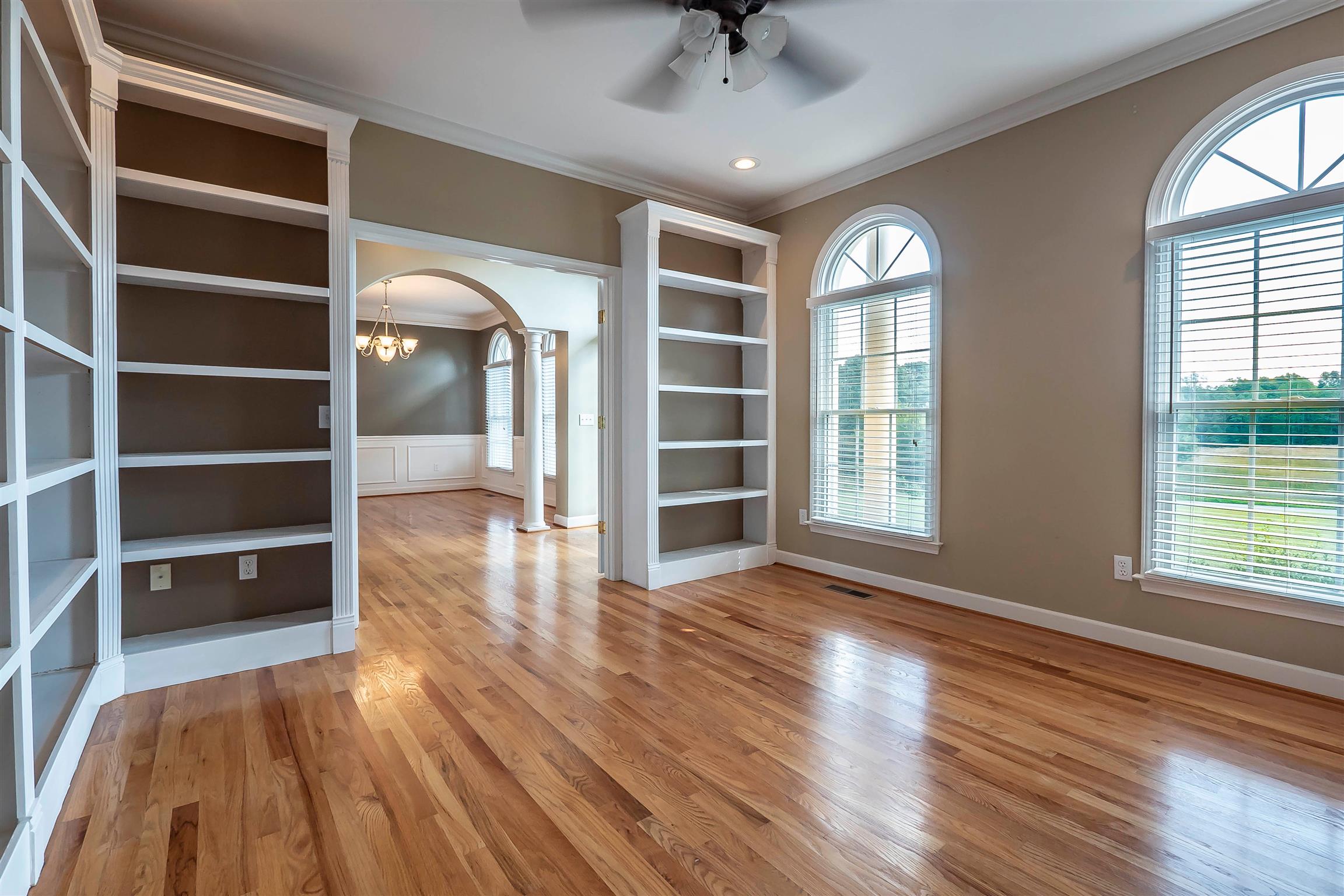 7722 Barnhill Road Primm Springs, TN 38476 - Photo 13 of 30 wooden floor in an empty room with a window
