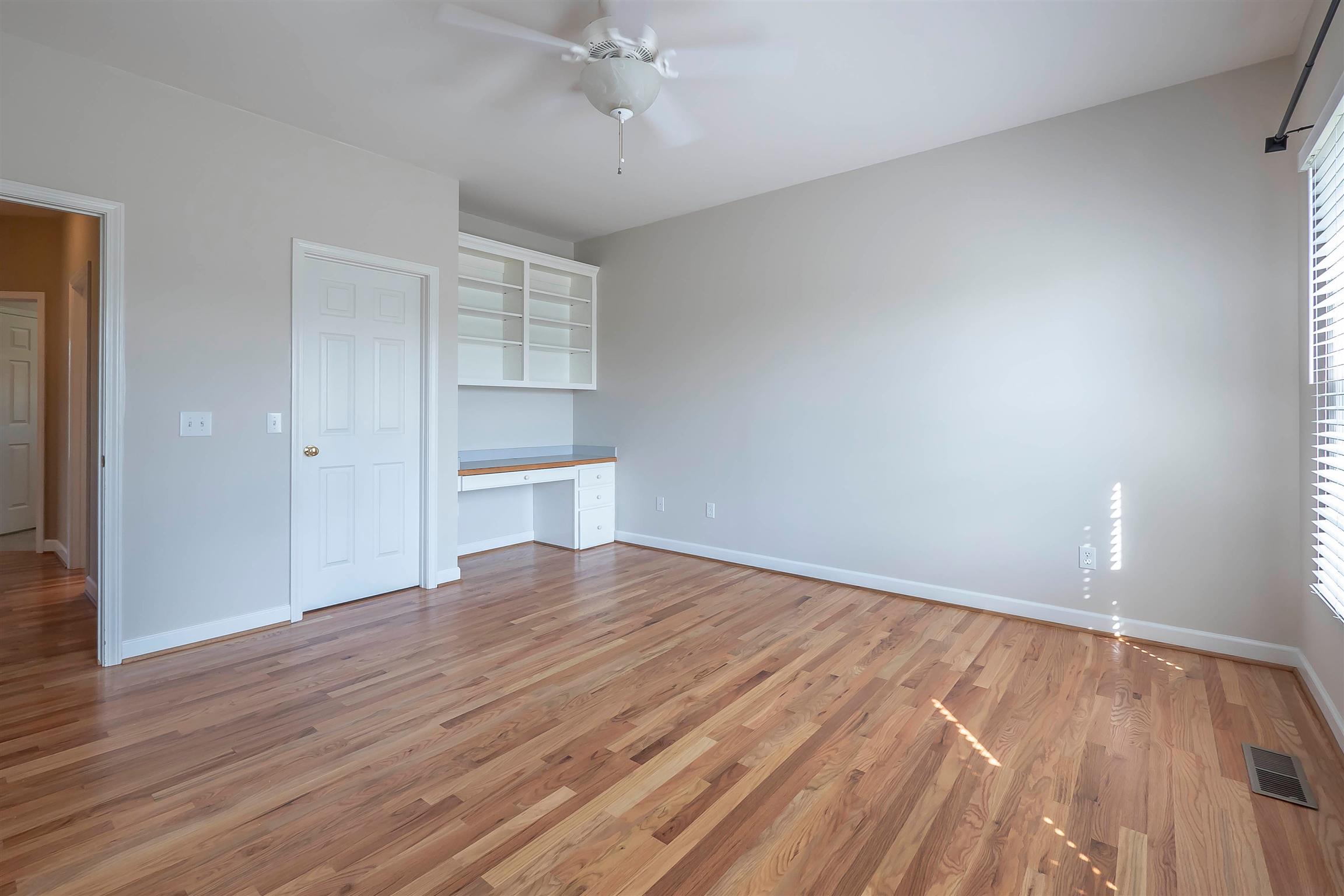 7722 Barnhill Road Primm Springs, TN 38476 - Photo 29 of 30 wooden floor in an empty room with a window