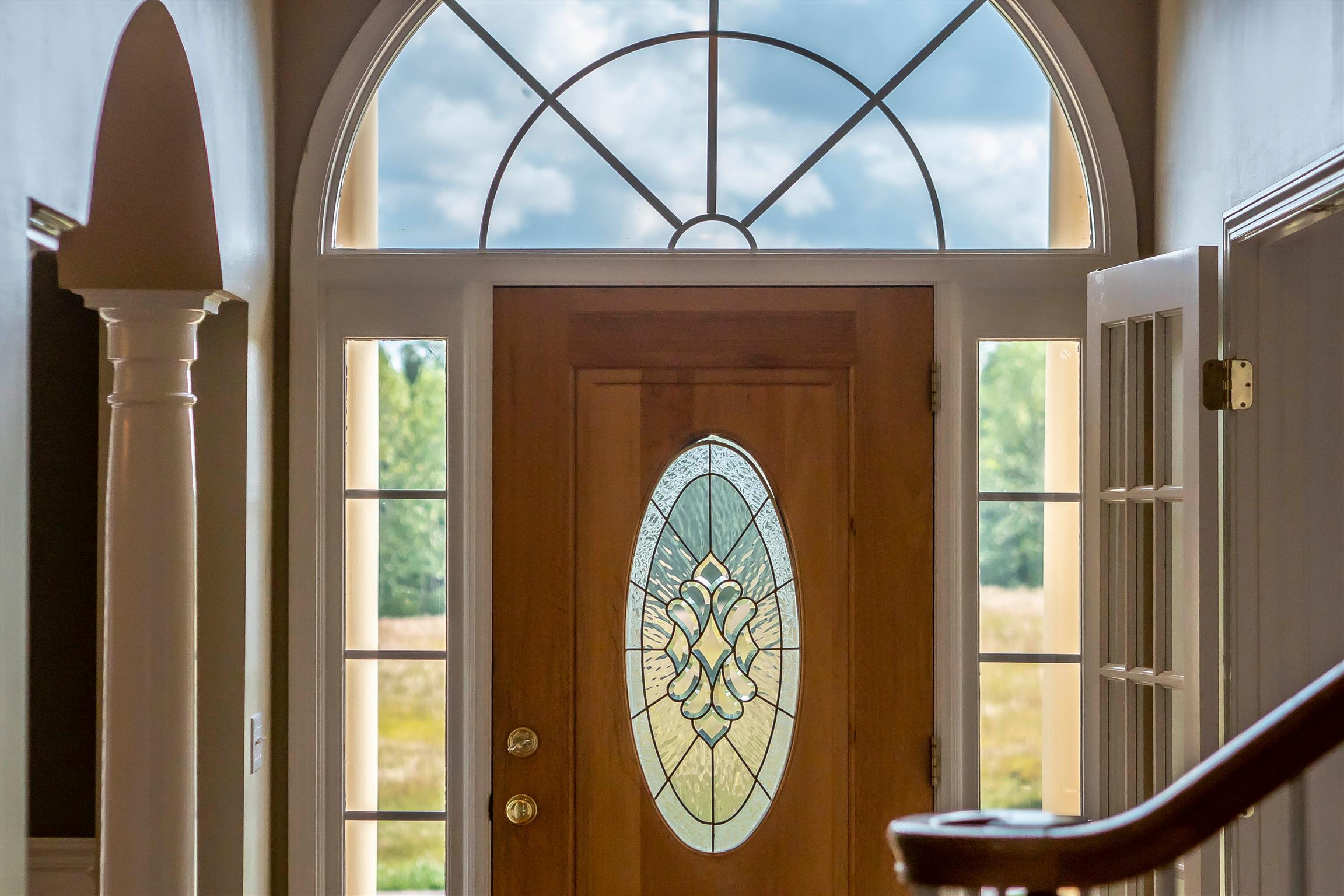 7722 Barnhill Road Primm Springs, TN 38476 - Photo 8 of 30 a view of large windows with a flower pot next to a window