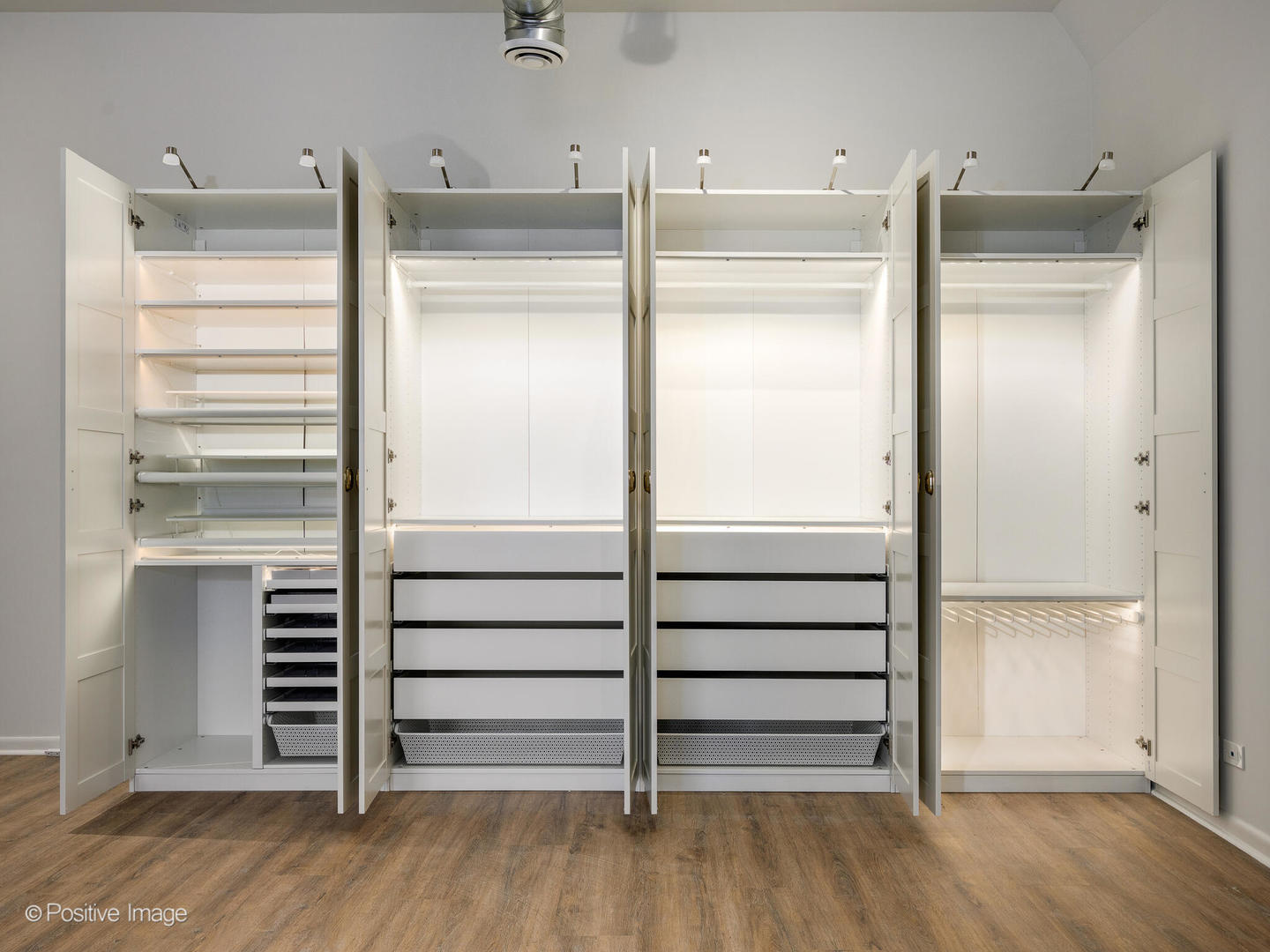 2418 West Bloomingdale Avenue, Unit 102 Chicago, IL 60647 - Photo 14 of 14 a view of walk in closet with empty racks