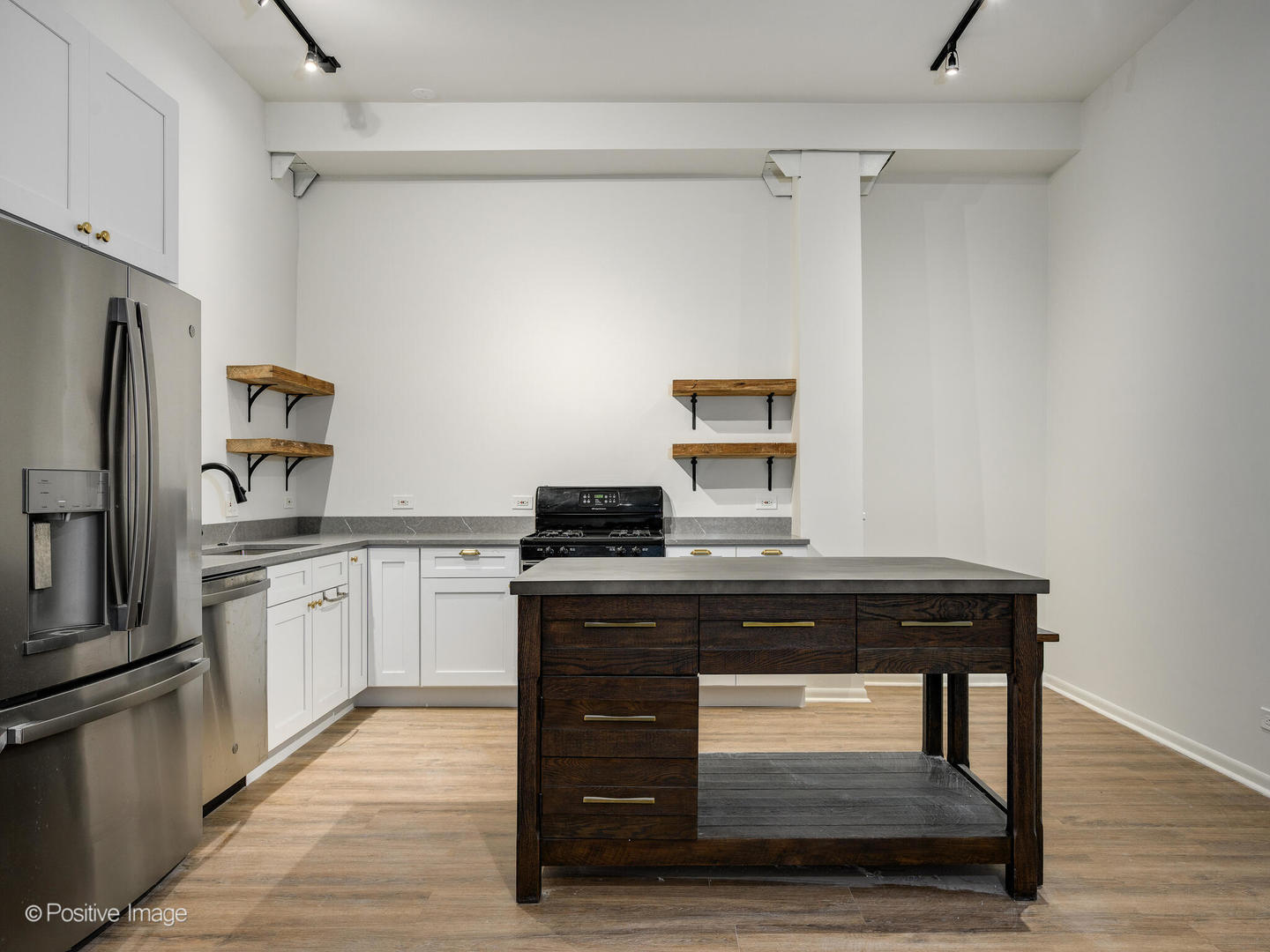 2418 West Bloomingdale Avenue, Unit 102 Chicago, IL 60647 - Photo 10 of 14 a kitchen with a stove and refrigerator