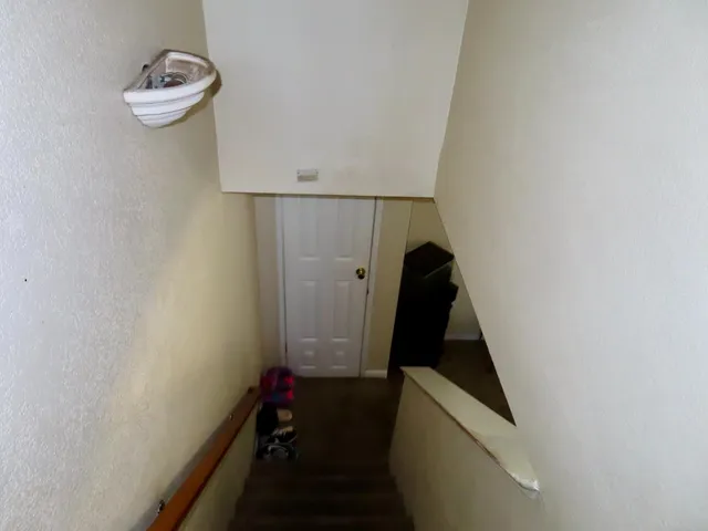 a view of bathroom with a sink and glass door