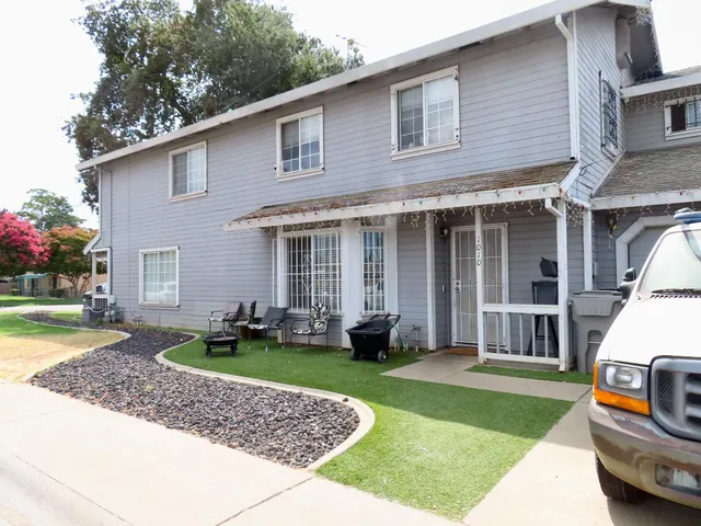 a living room with furniture and a closet