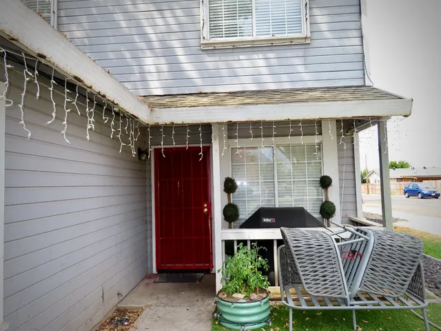 a living room with furniture rug and window