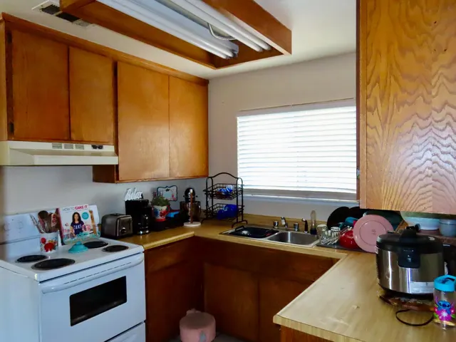 a view of a livingroom with furniture and a flat screen tv