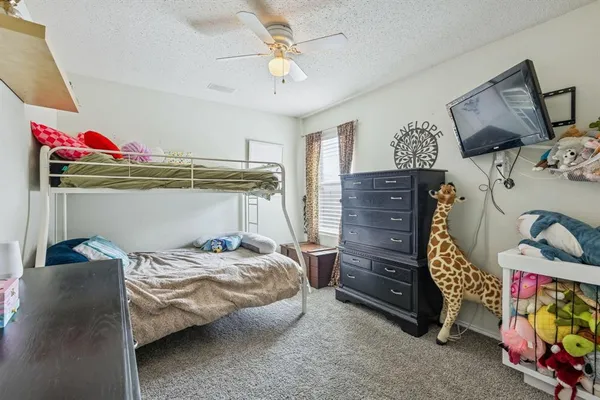 a bedroom with a bed and a closet