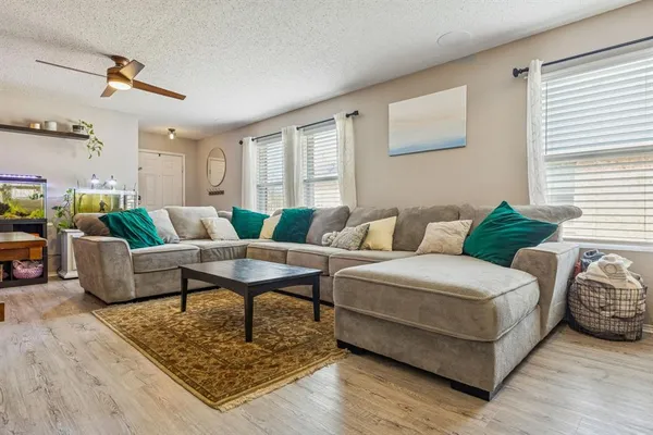a living room with furniture and a table