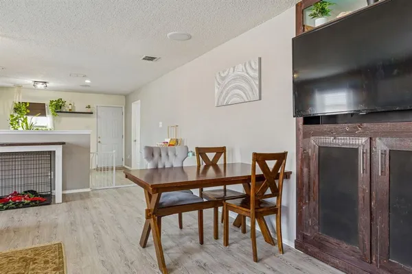 a dining room with furniture and fireplace