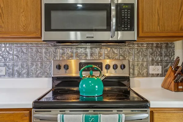 a kitchen with a stove and a microwave