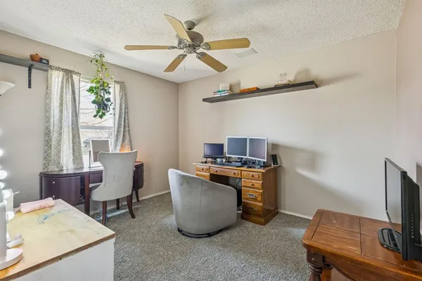 a workspace with furniture and window