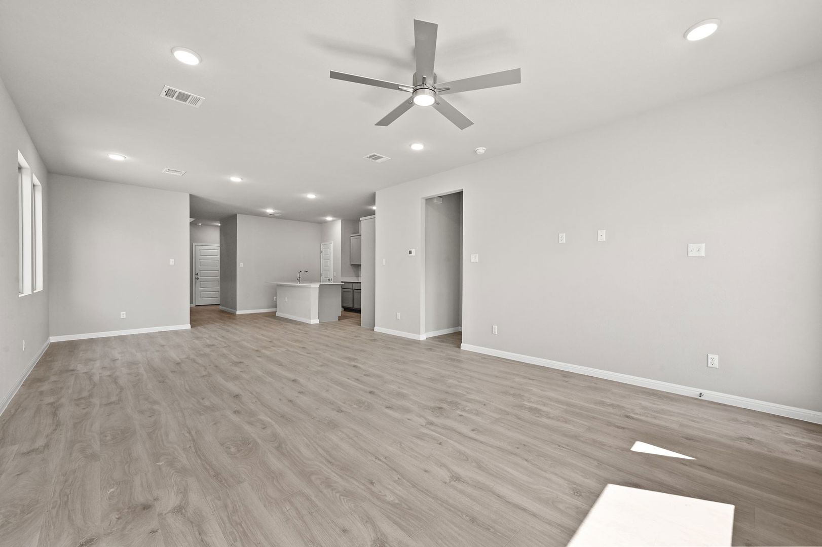 174 Hornet Street Elgin, TX 78621 - Photo 11 of 36 a view of an empty room with a ceiling fan