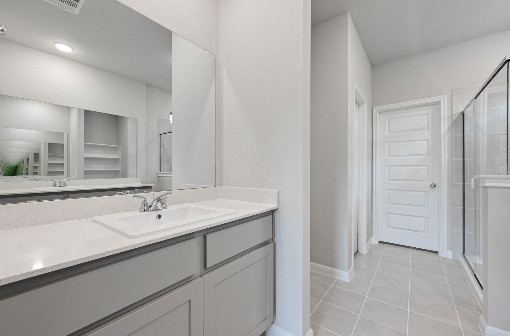 174 Hornet Street Elgin, TX 78621 - Photo 15 of 36 a bathroom with a sink and a mirror