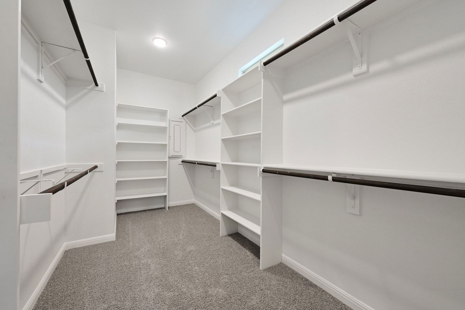 174 Hornet Street Elgin, TX 78621 - Photo 16 of 36 a view of walk in closet with empty racks