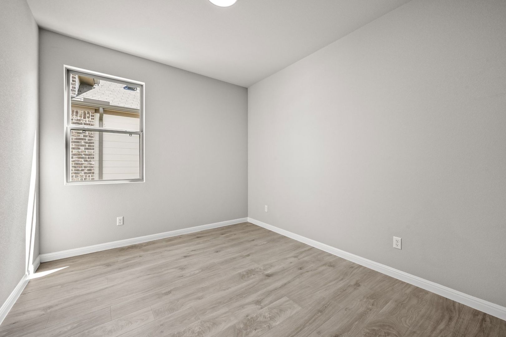 174 Hornet Street Elgin, TX 78621 - Photo 17 of 36 an empty room with a window