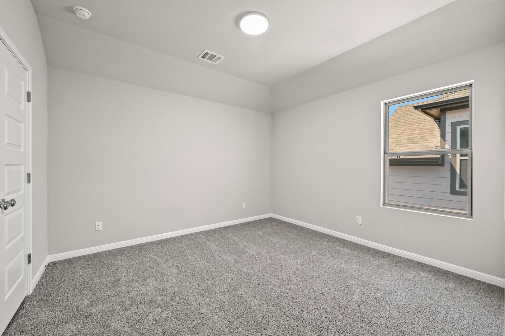 174 Hornet Street Elgin, TX 78621 - Photo 20 of 36 an empty room with windows and closet