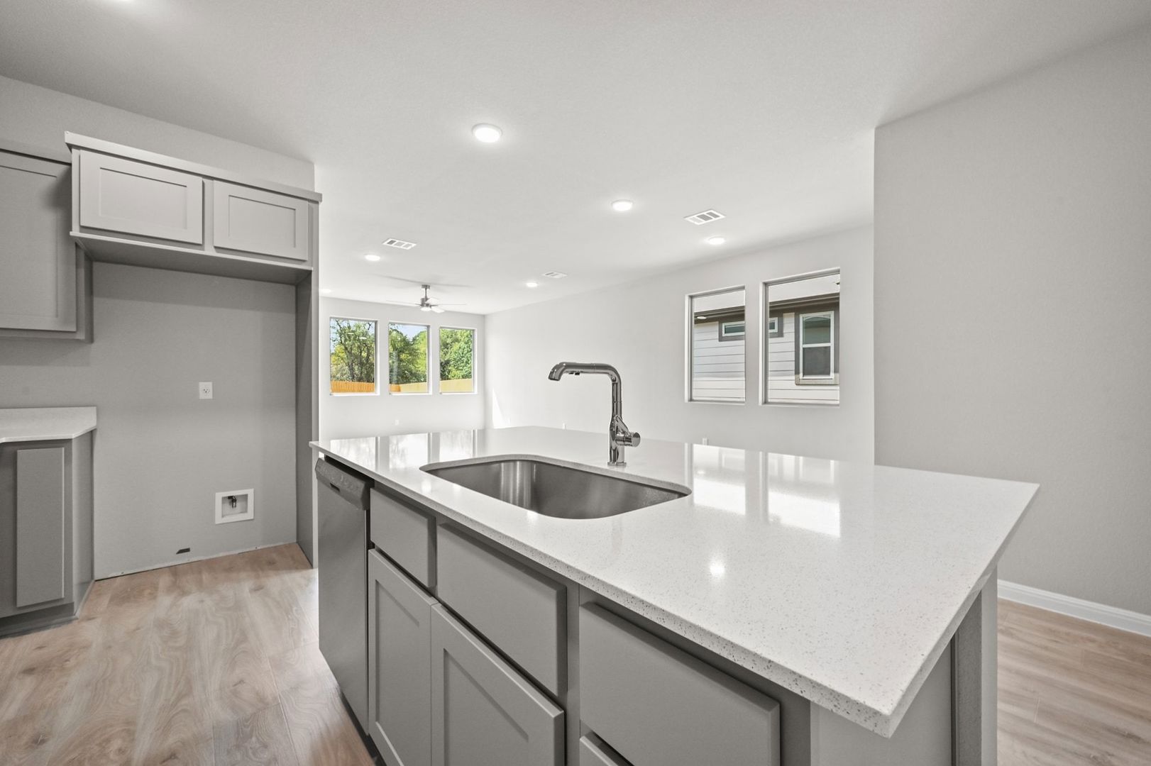 174 Hornet Street Elgin, TX 78621 - Photo 7 of 36 a kitchen with a sink and cabinets