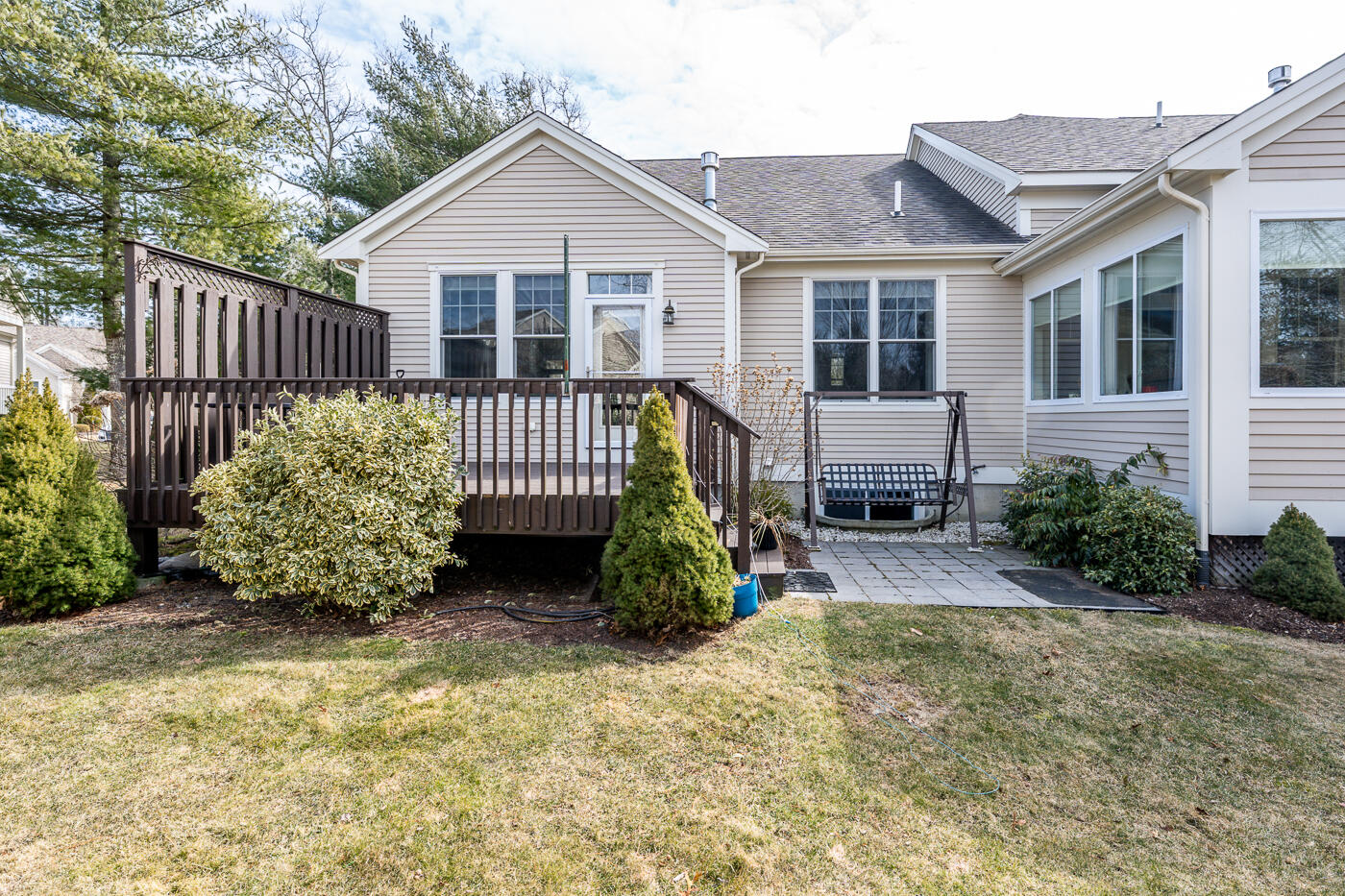 27 Grey Hawk Drive Mashpee, MA 02649 - Photo 22 of 40 a view of a house with wooden fence next to a yard