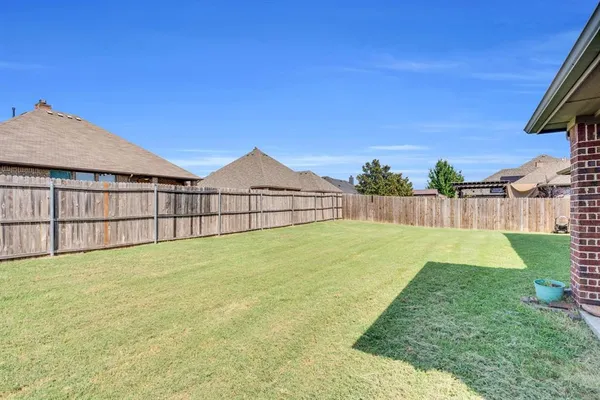 a view of backyard with green space