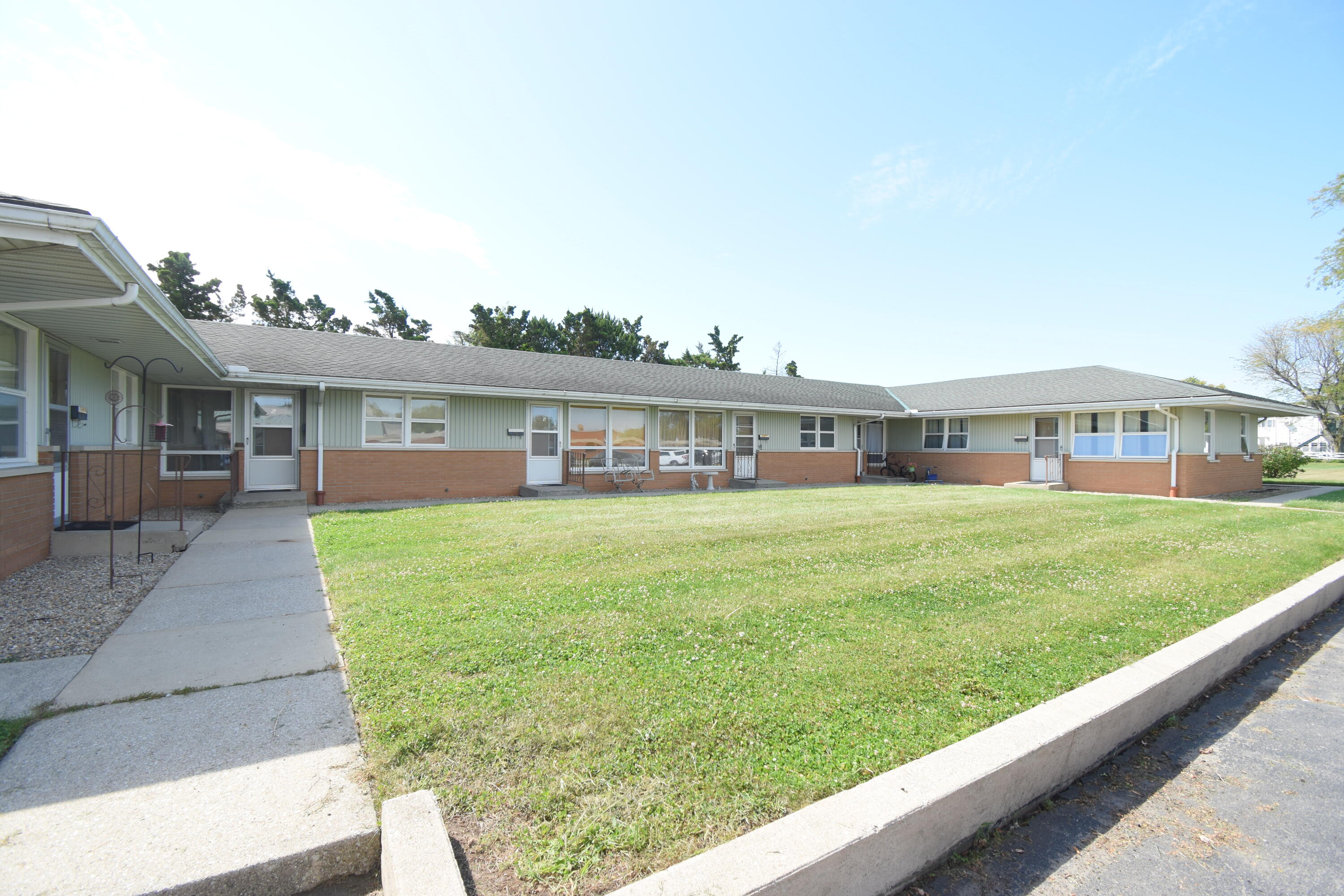 a front view of building with yard