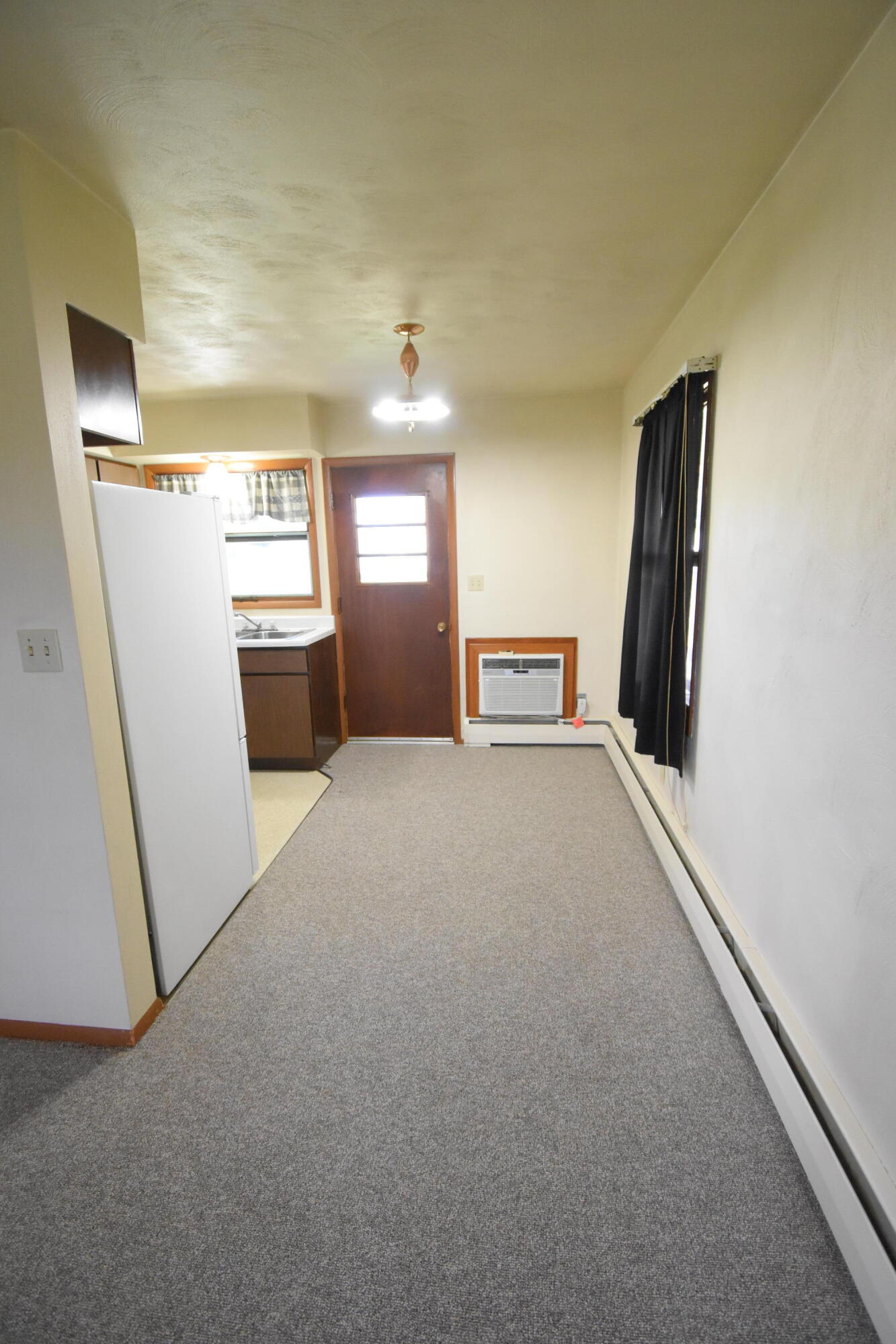 981 East Washington Street Rensselaer, IN 47978 - Photo 5 of 21 a view of livingroom with hardwood and hallway