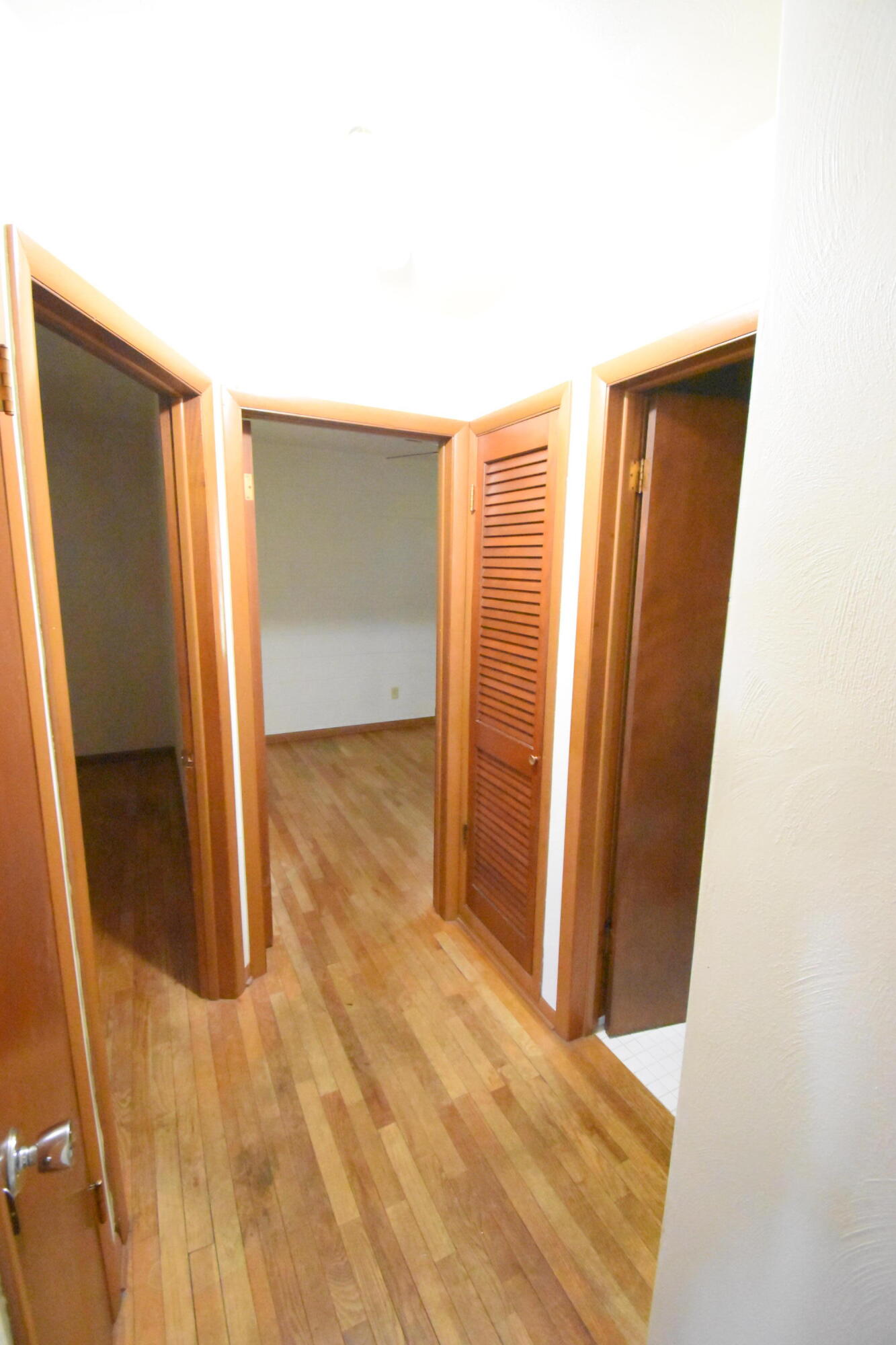 981 East Washington Street Rensselaer, IN 47978 - Photo 8 of 21 an empty room with wooden floor and closet