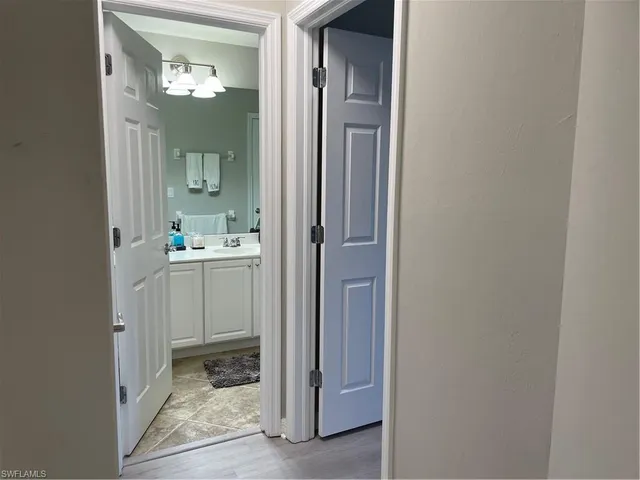 a bathroom with sink and mirror
