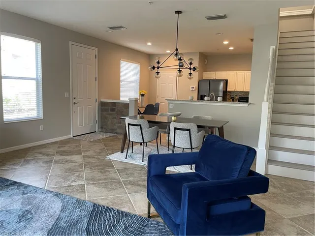 a view of a livingroom with furniture and window