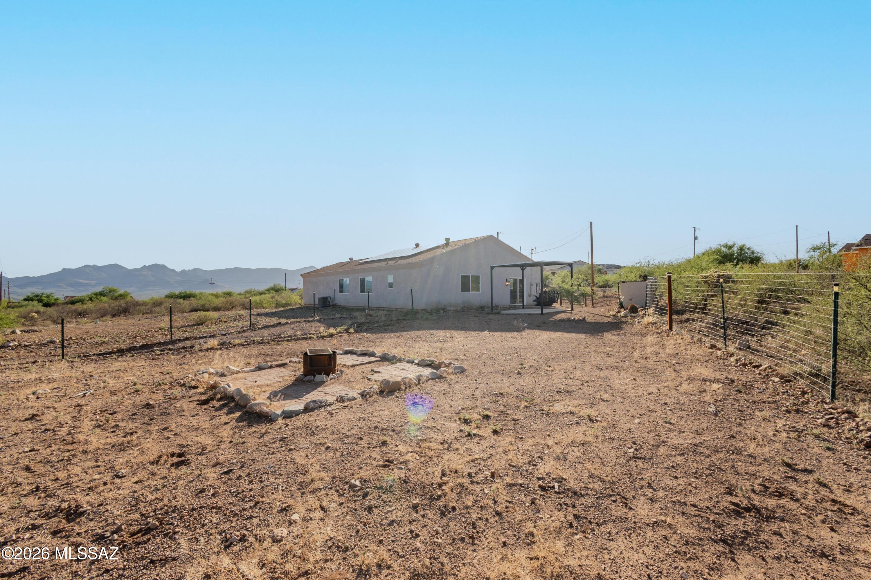 1785 Dove Court Rio Rico, AZ 85648 - Photo 30 of 31 a view of a house with a yard