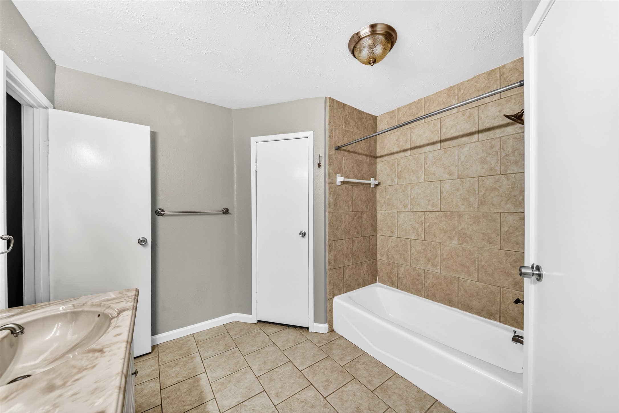 3119 Oak Rock Spring, TX 77373 - Photo 16 of 25 a bathroom with a bathtub and shower
