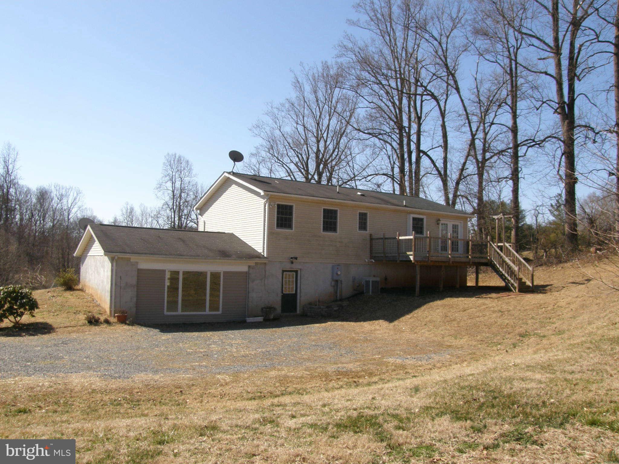 8230 Old Stillhouse Road Rixeyville, VA 22737 - Photo 2 of 30 a house with trees in the background
