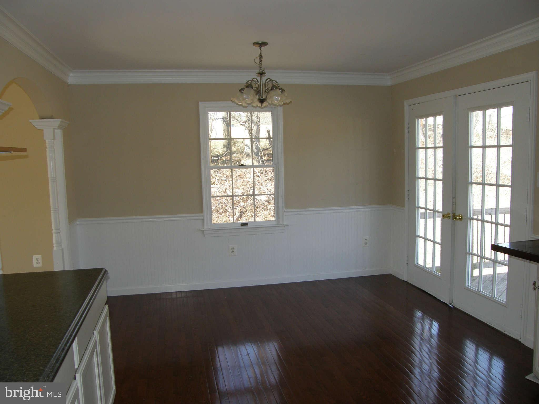 8230 Old Stillhouse Road Rixeyville, VA 22737 - Photo 12 of 30 a view of an empty room with wooden floor and a window
