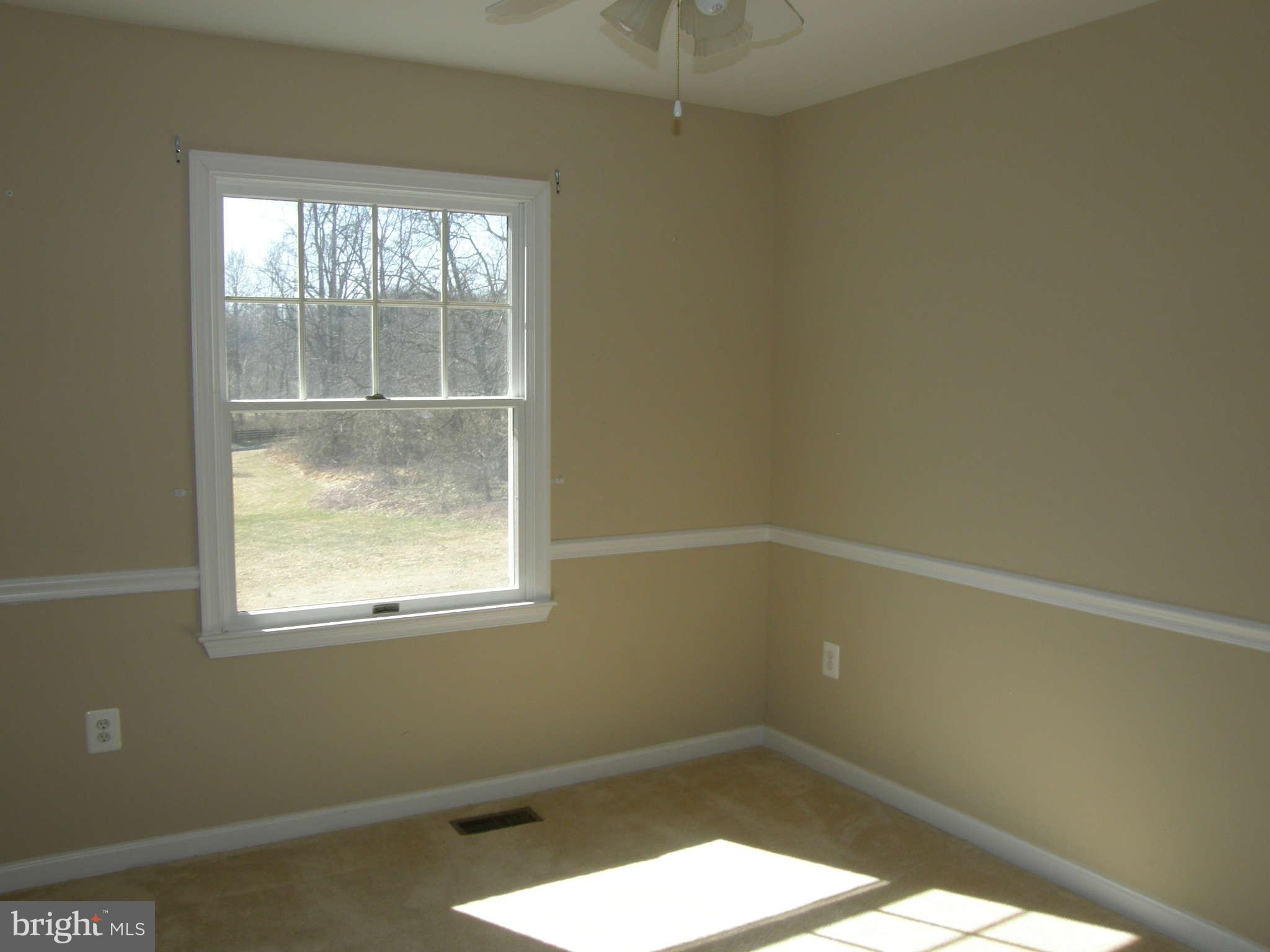 8230 Old Stillhouse Road Rixeyville, VA 22737 - Photo 16 of 30 an empty room with a window