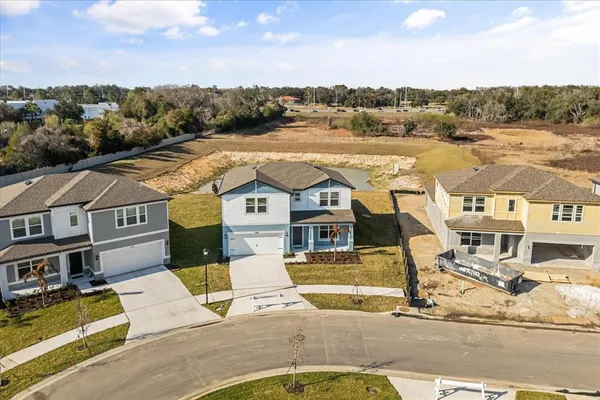 an aerial view of a house with a ocean view