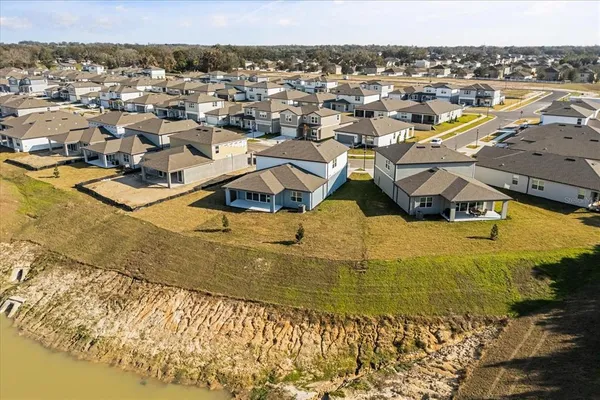 an aerial view of a house with a swimming pool
