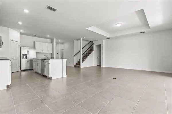 a view of a kitchen with appliances and cabinets