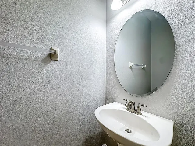 an aerial view of residential houses with outdoor space and swimming pool