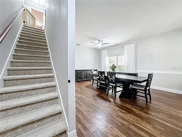 a kitchen with stainless steel appliances granite countertop a sink a stove and cabinets